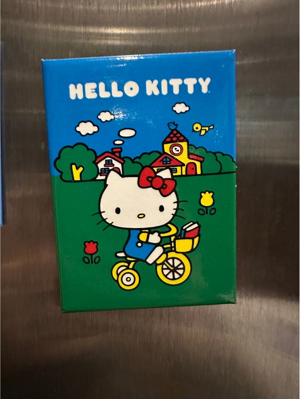 Hello Kitty Fridge Magnet Featuring Hello Kitty on Bicycle